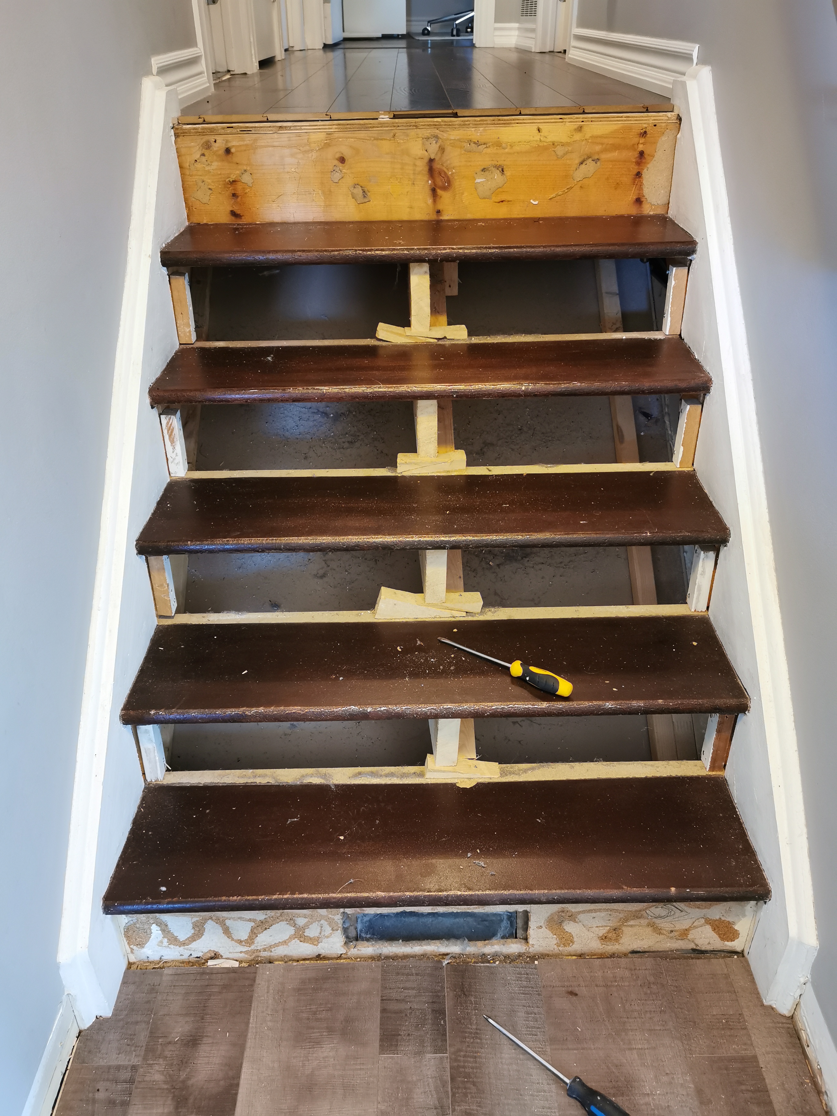Here is an image of a flooring or stair renovation.