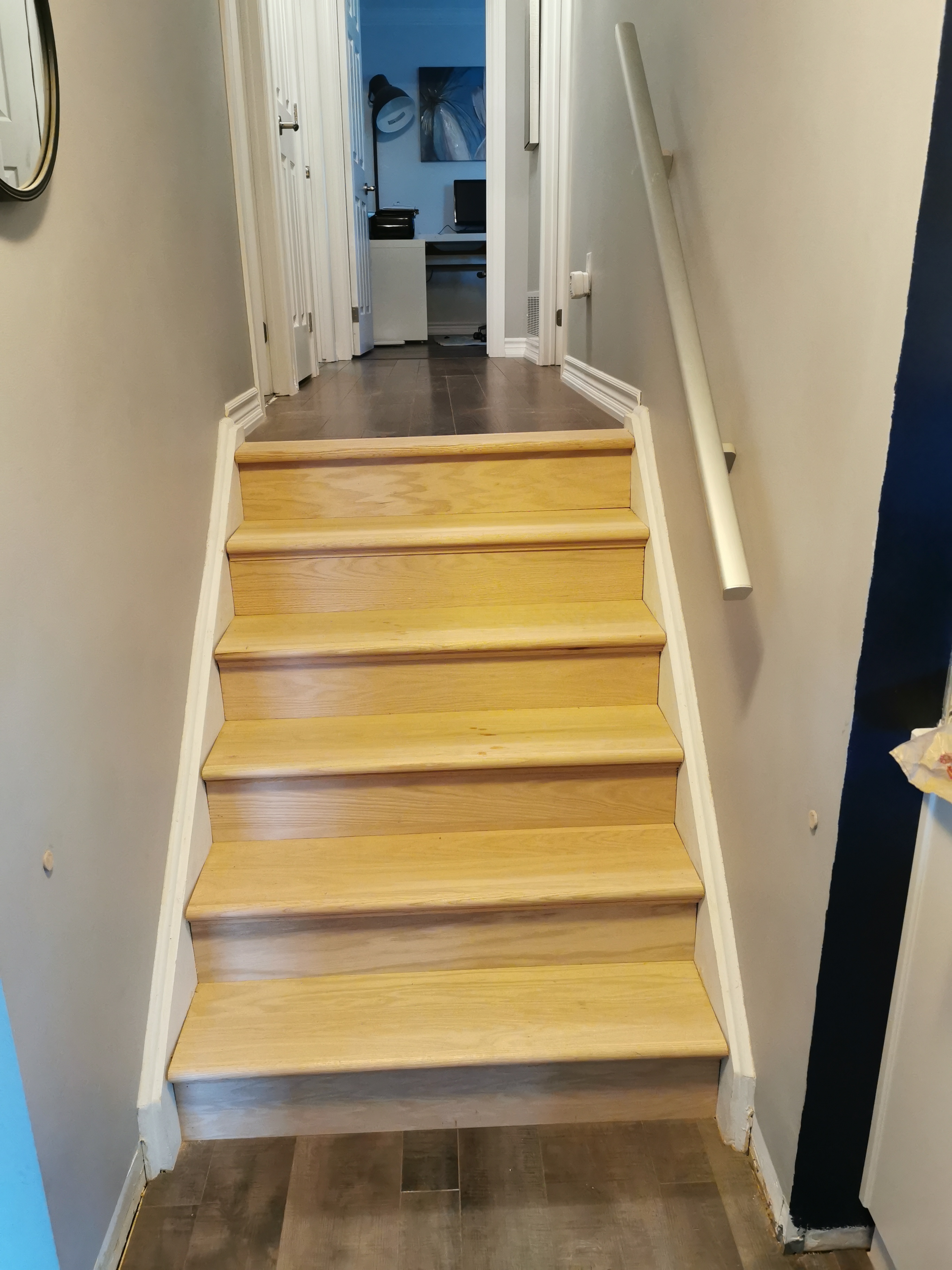 Here is an image of a flooring or stair renovation.