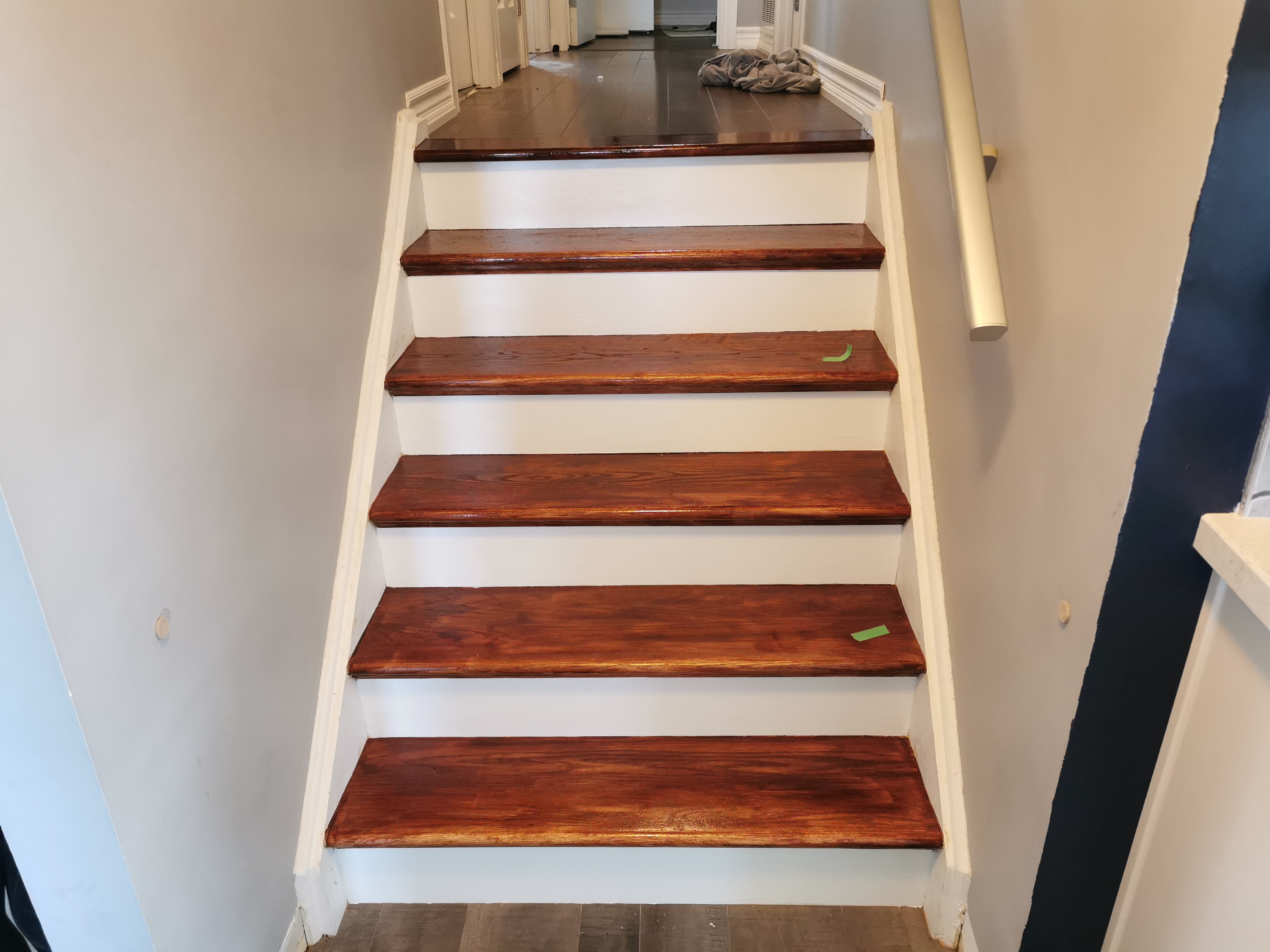 Here is an image of a flooring or stair renovation.